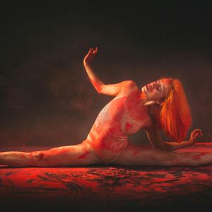 Athlete performing a dynamic stretching movement.